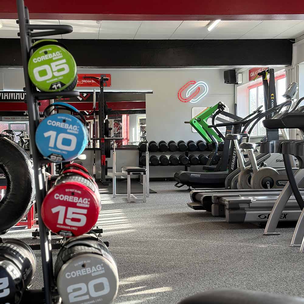 Colour-coded dumbbell rack in gym