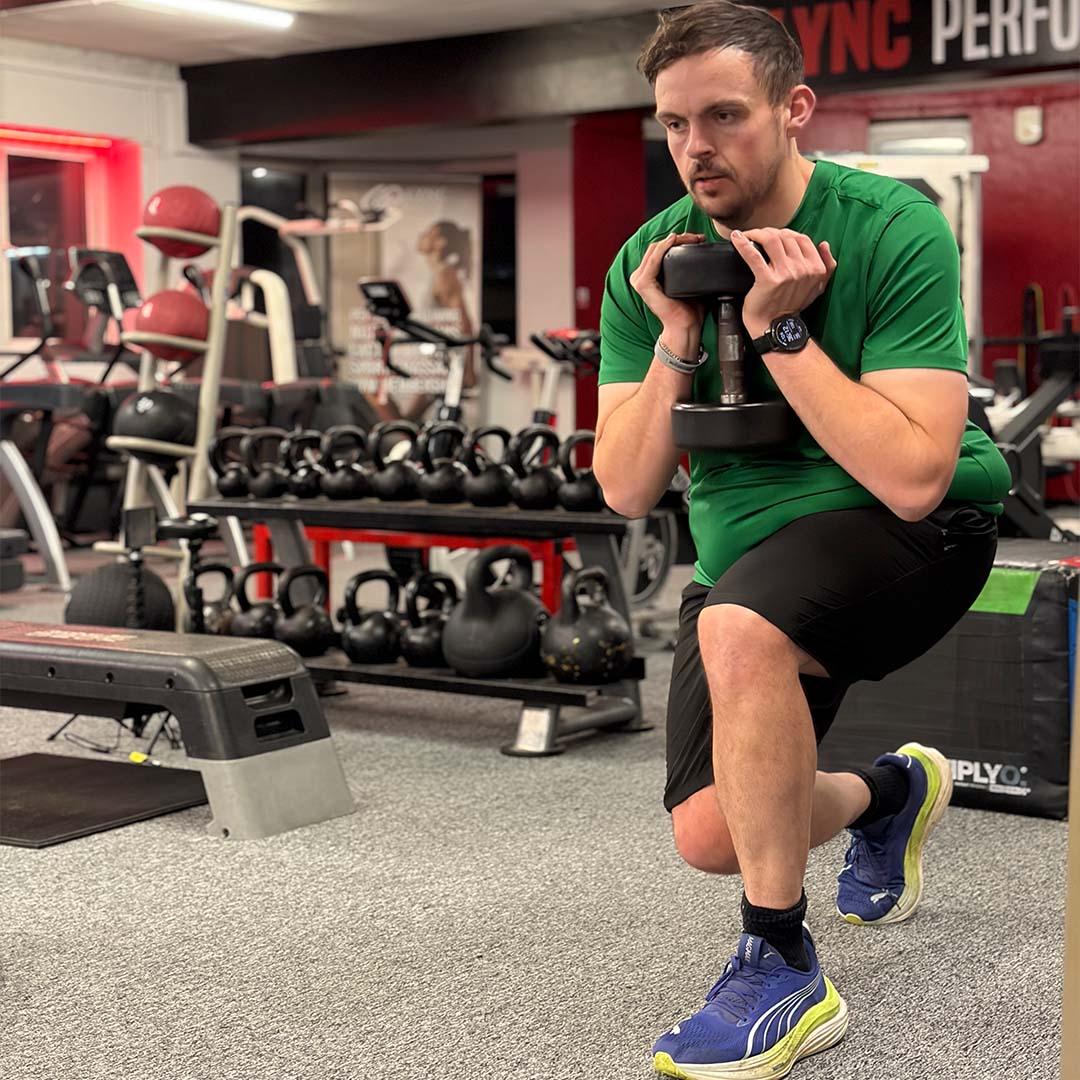 Athlete performing strength exercise in gym