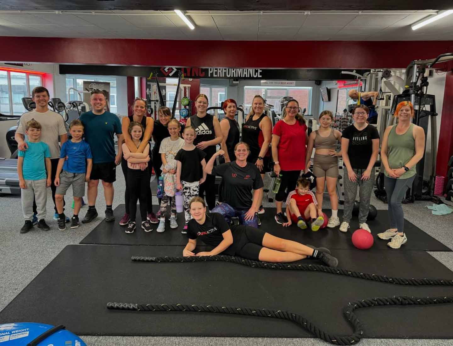 Group posing inside Lync gym after training
