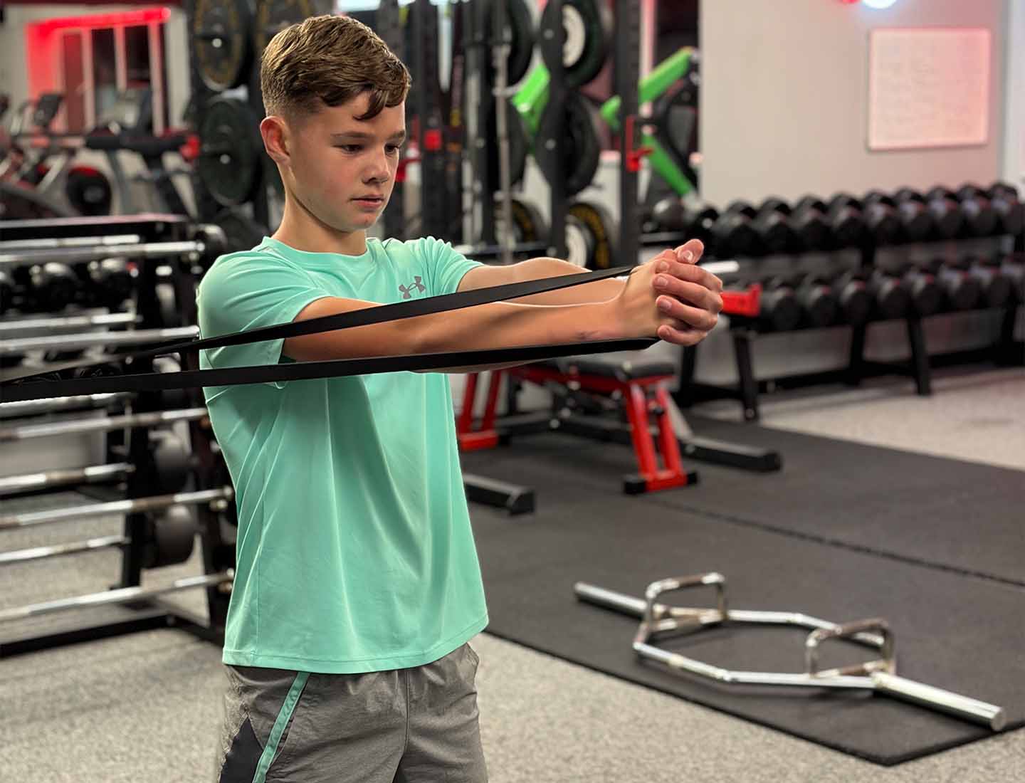Young athlete performing resistance band exercise