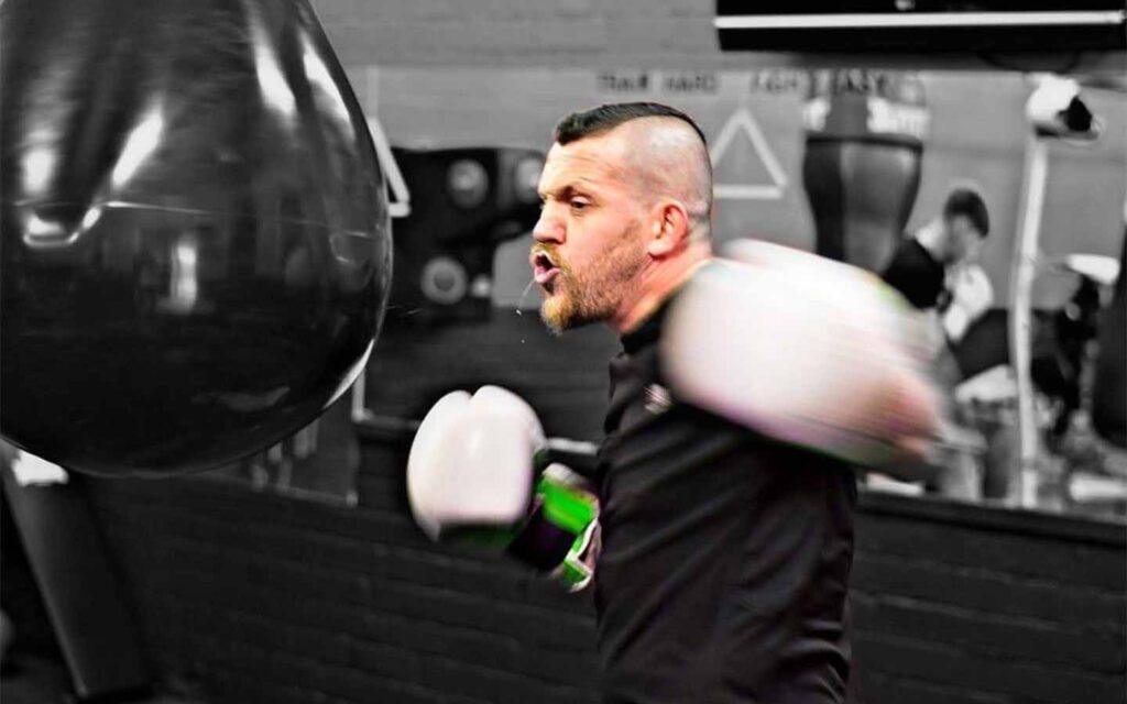 Boxer throwing punch during training session