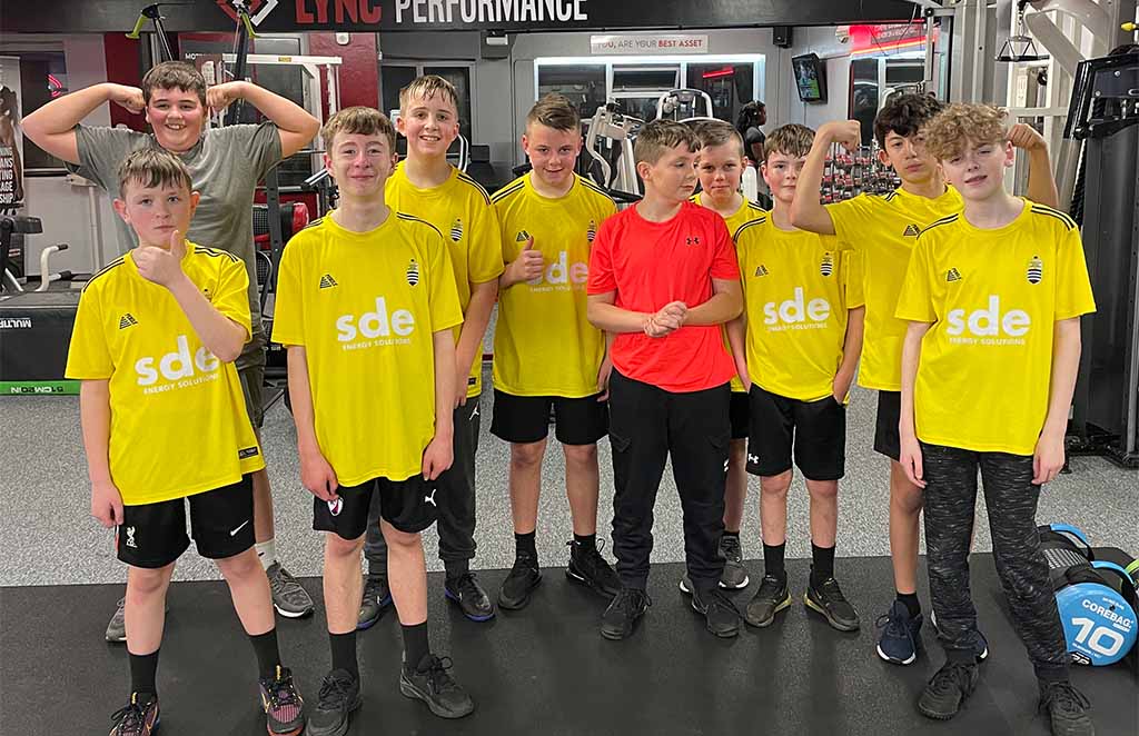 Youth football players attending performance training session