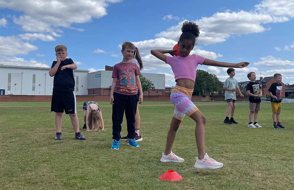 Children participating in outdoor fitness and activity session