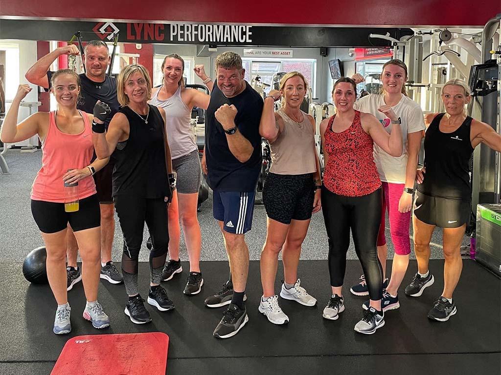 Members posing after gym training session