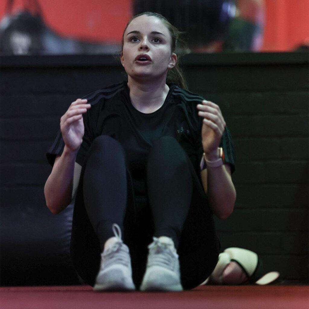 Athlete performing core conditioning exercise at Lync Active gym