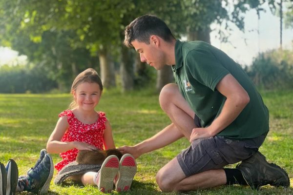 Parent and child taking part in outdoor activity
