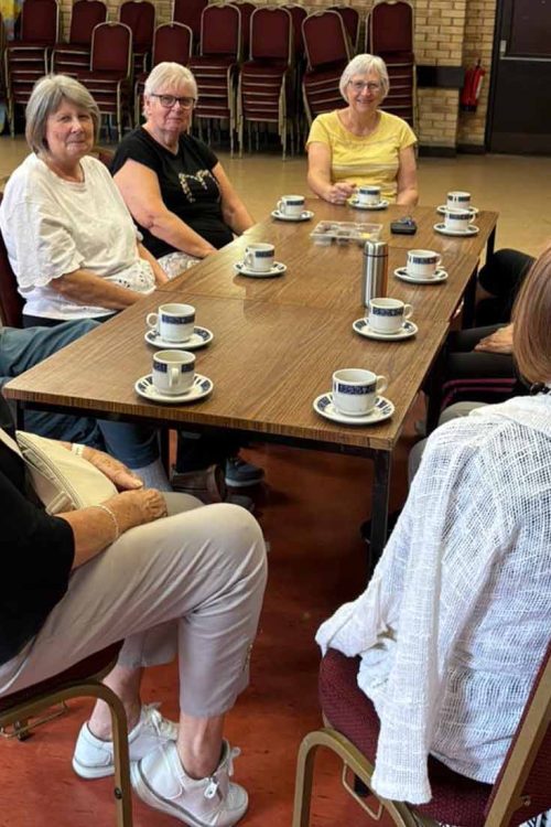 Community group seated around table