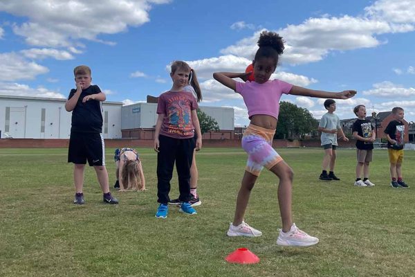 Children participating in outdoor fitness and activity session
